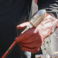 Operator holding a Reaper nozzle